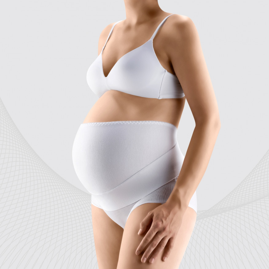 Premium Photo  Close up of elastic maternity band dressed on pregnant  woman in underwear to reduce backache at pink background with copy space.  orthopedic abdominal support belt concept.